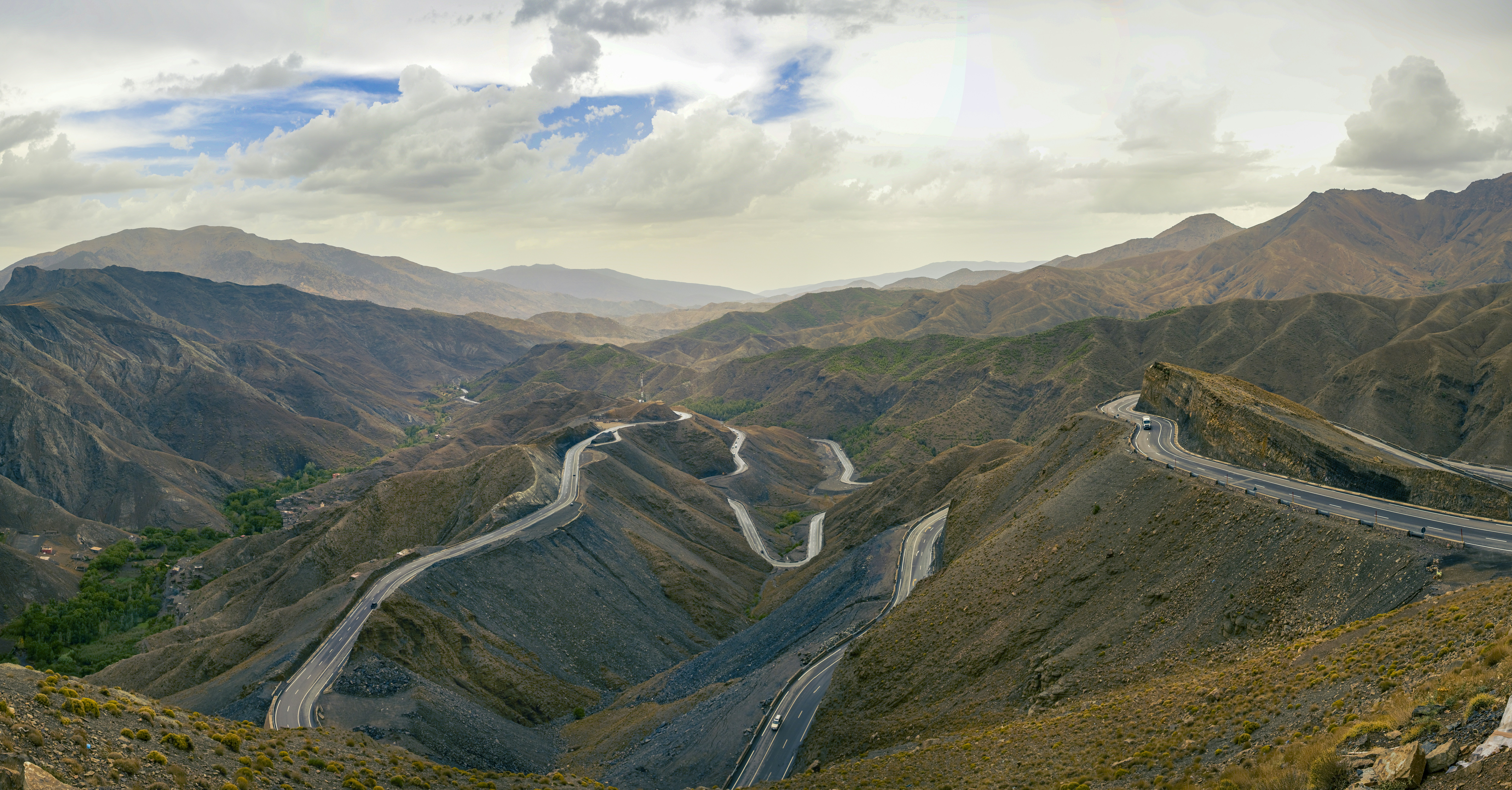 A view of a winding road in the mountains