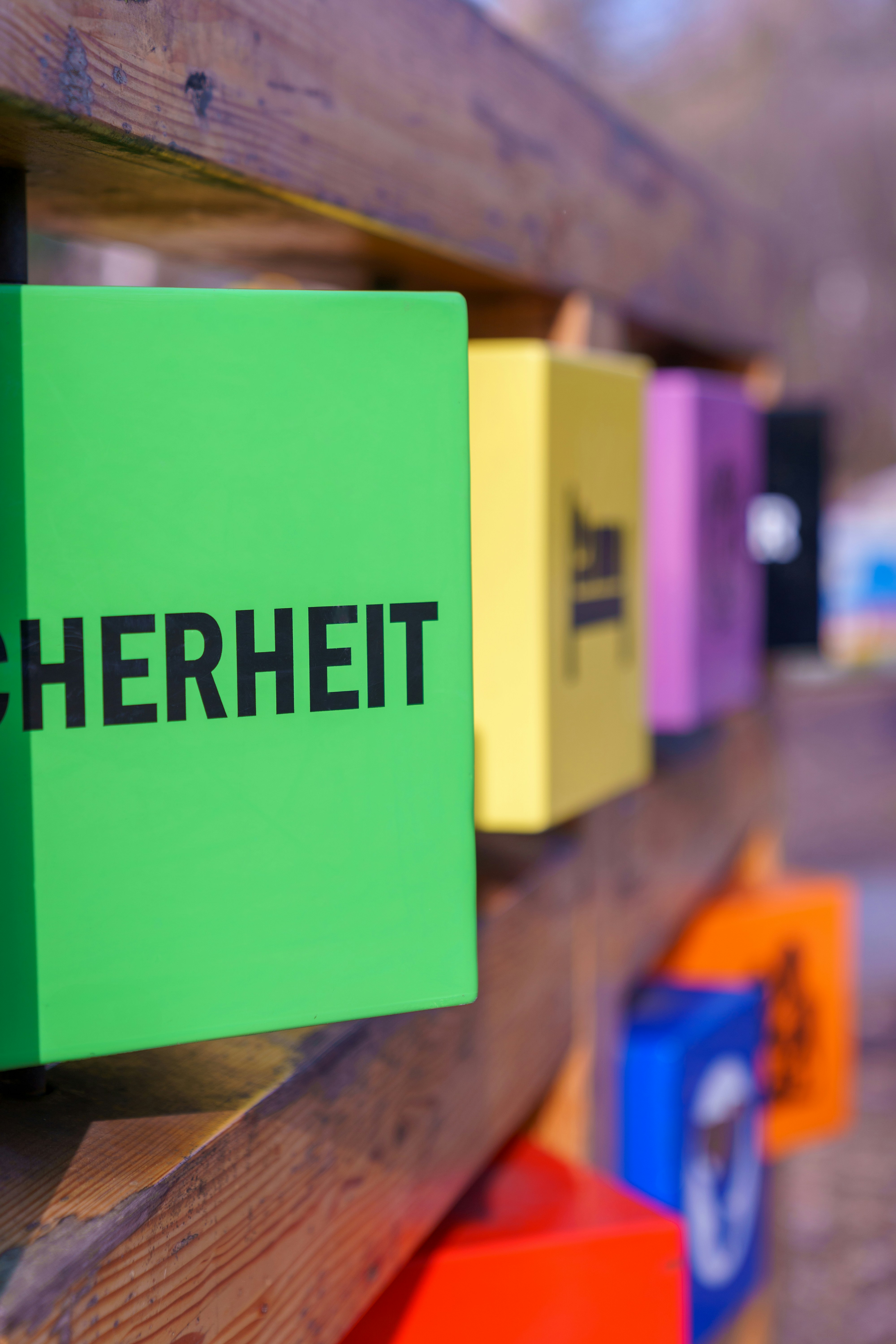 A close up of a sign on a wooden fence