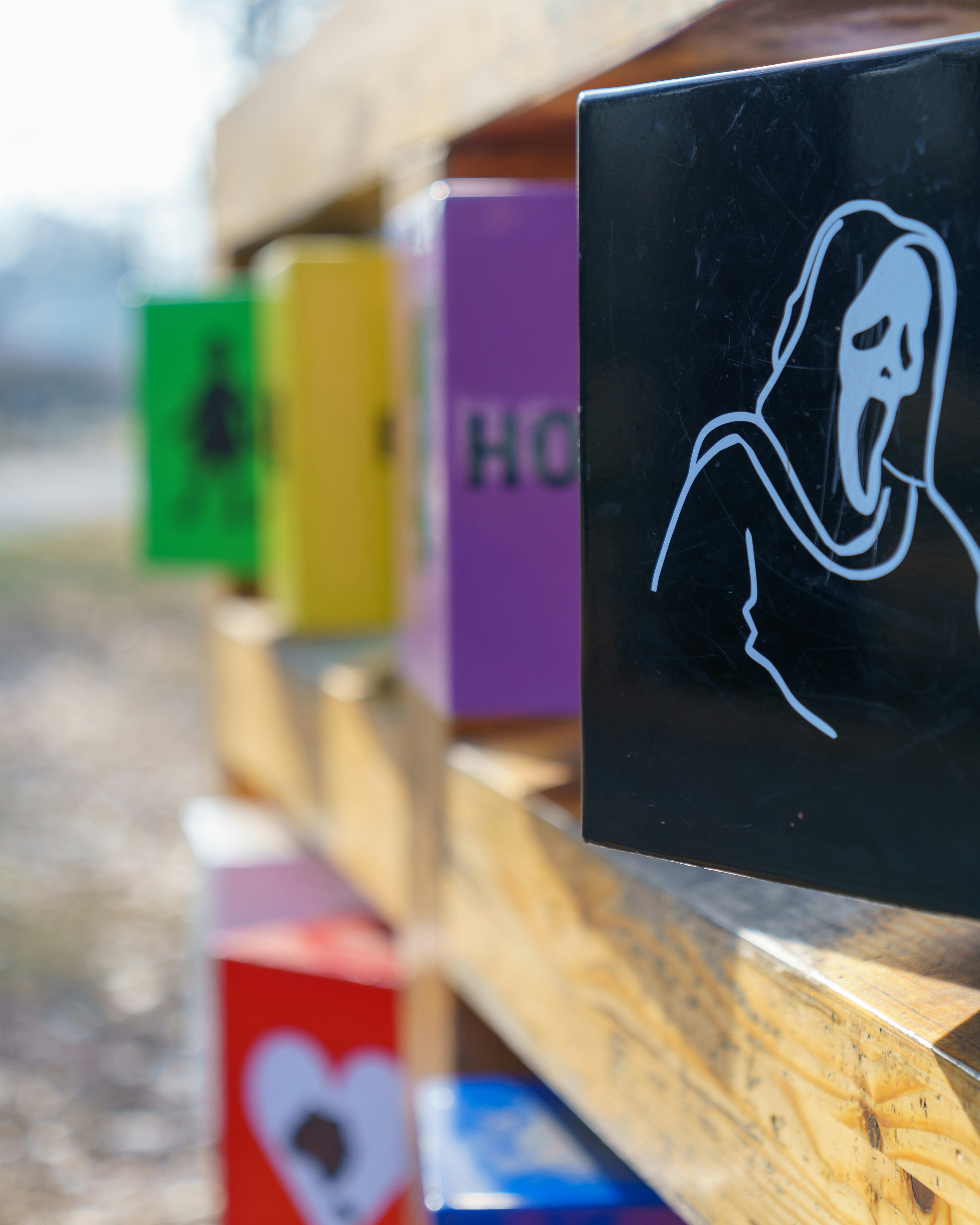 A bunch of different colored blocks with a sticker on them