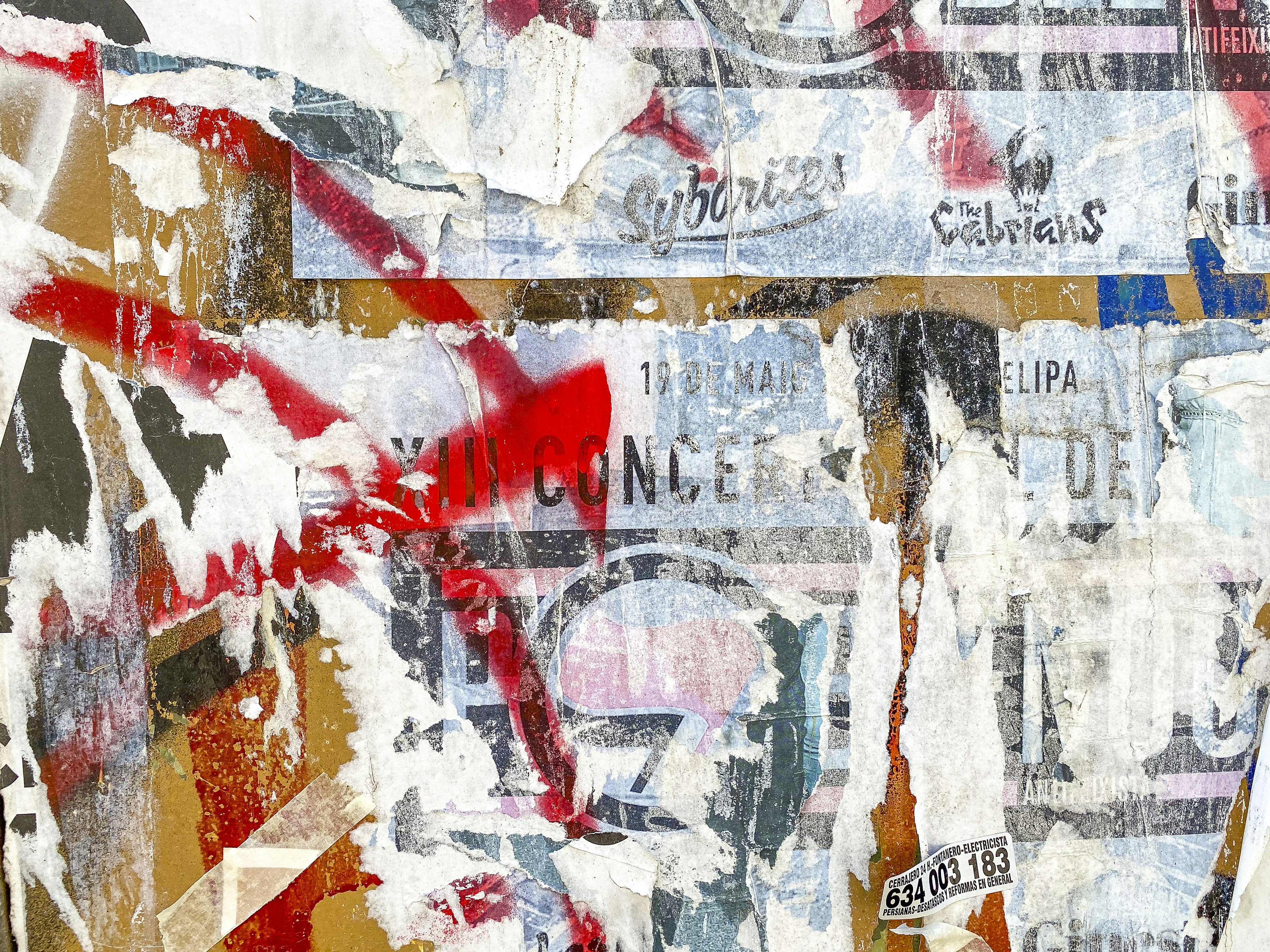 A collage of newspaper clippings with a red, white, and blue