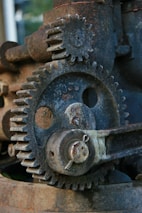 A close up of an old rusted metal gear