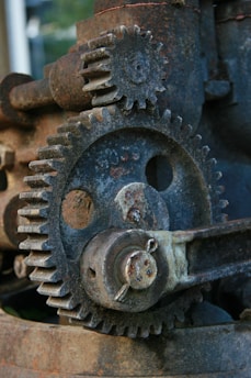 A close up of an old rusted metal gear