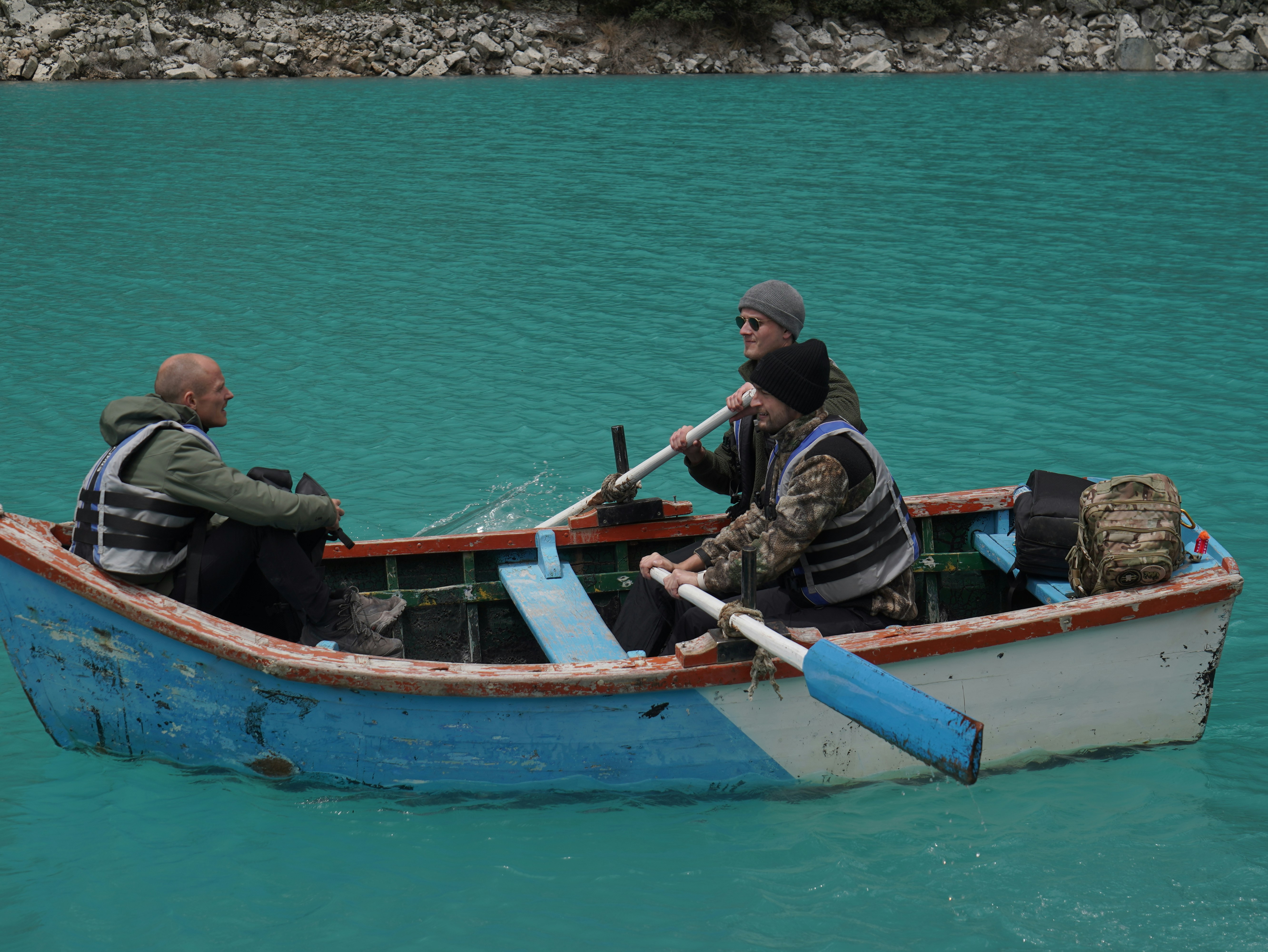 Two men in a small boat in the water
