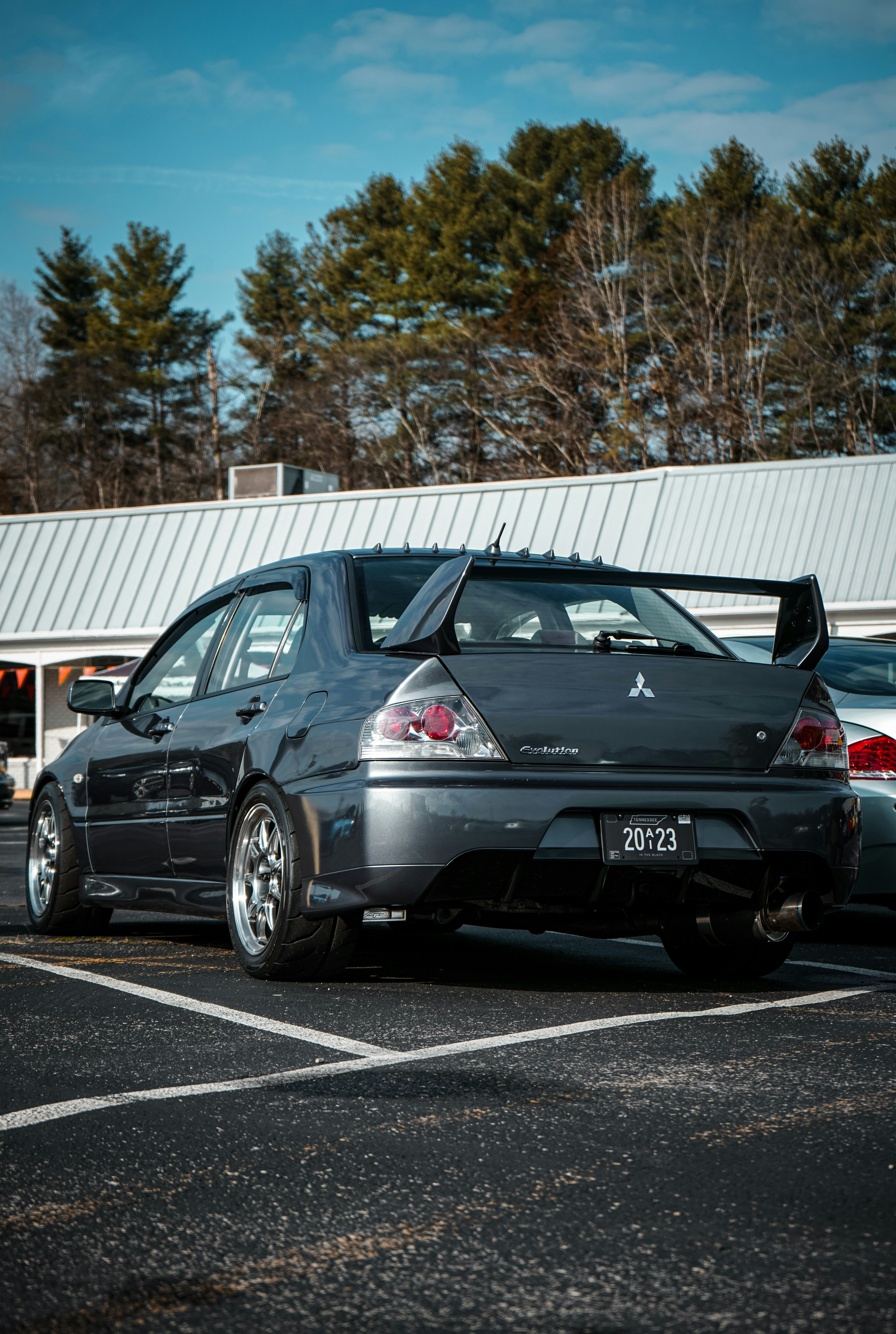 A couple of cars parked in a parking lot