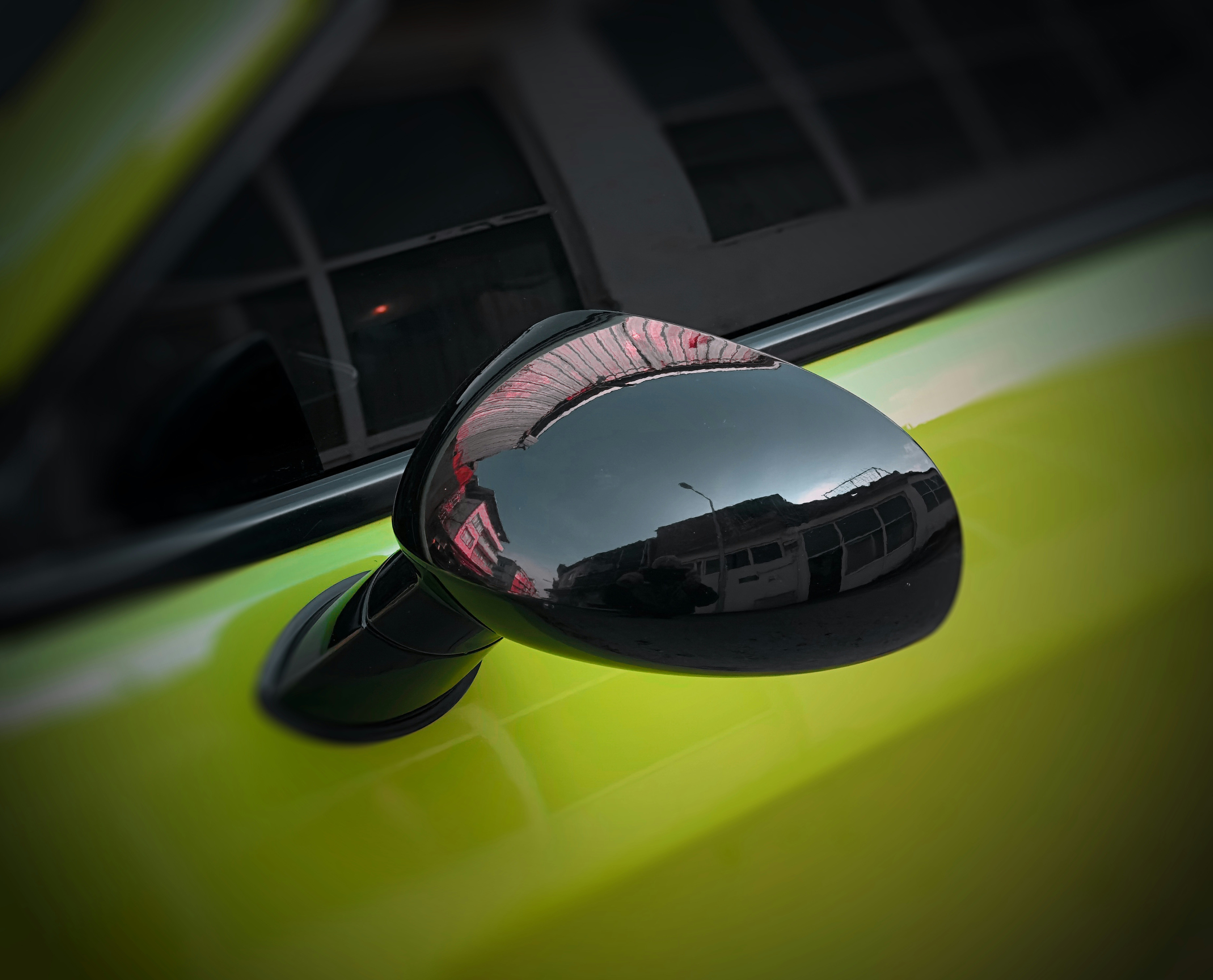A close up of a car's side view mirror