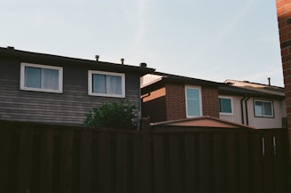A house with a fence in front of it