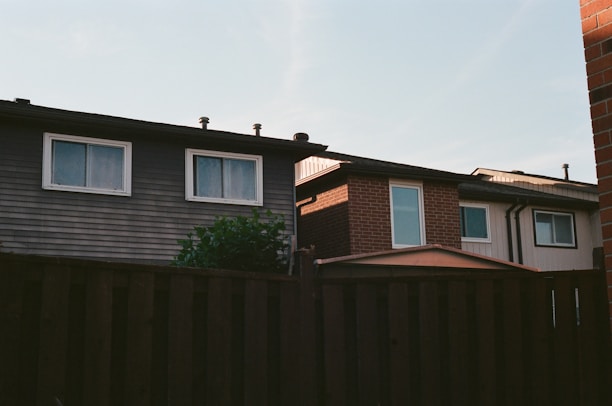 A house with a fence in front of it