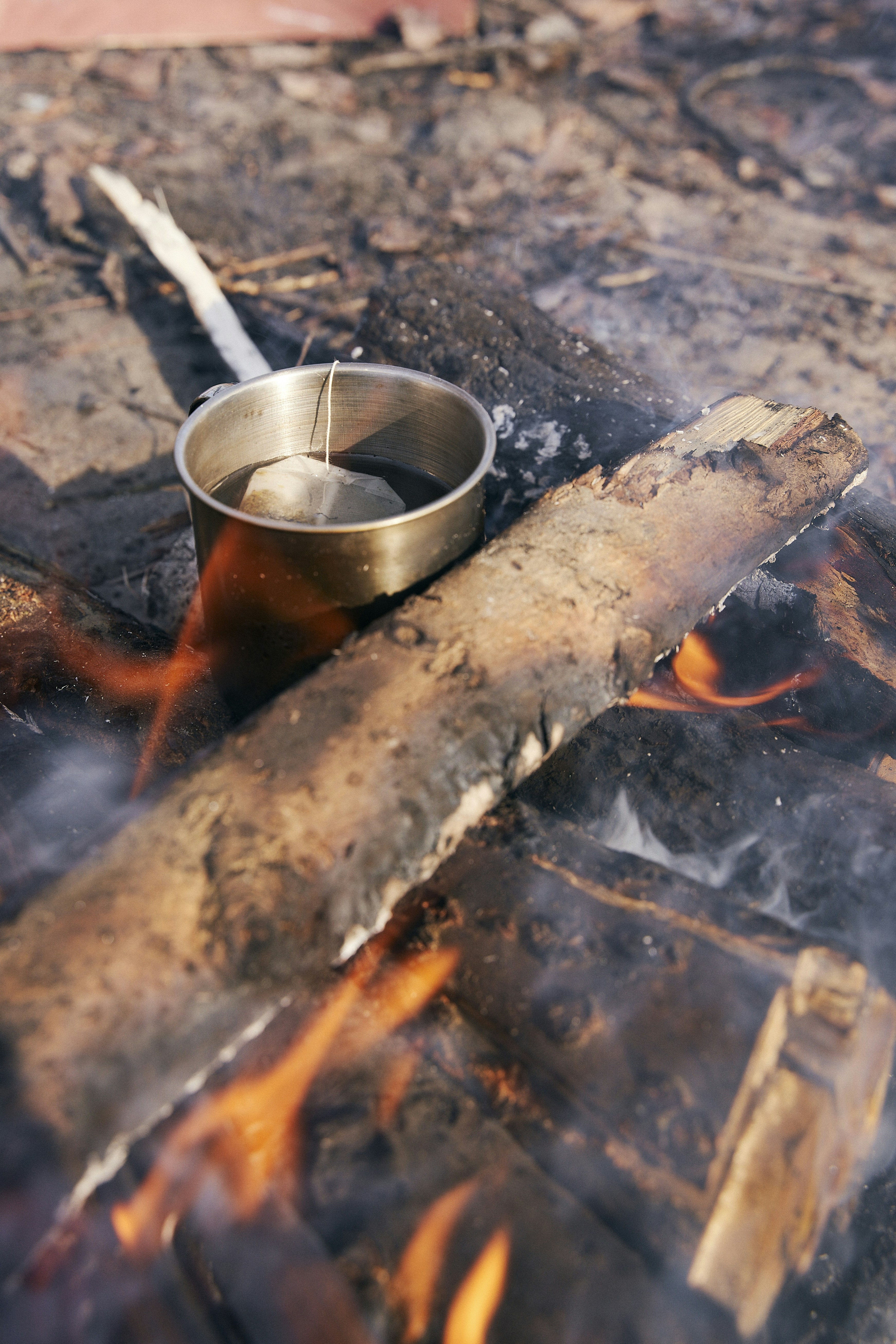 A metal bowl sitting on top of a fire