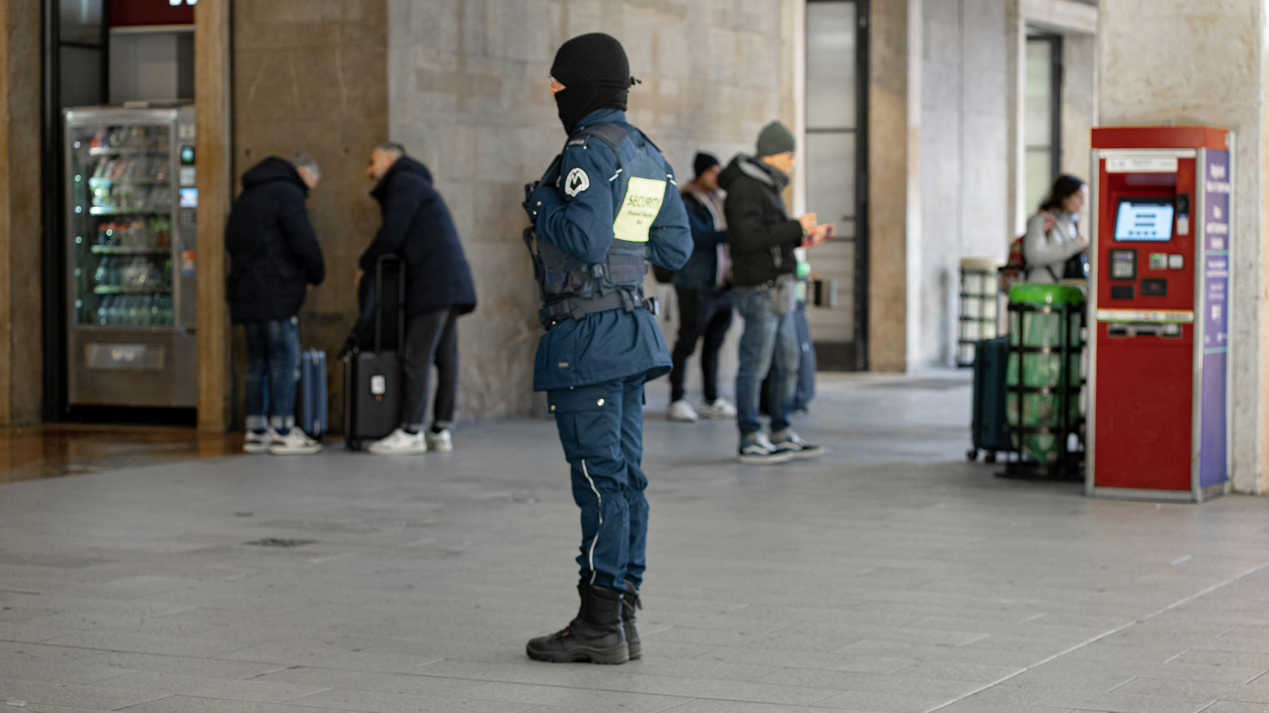 A guard standing in a commercial building