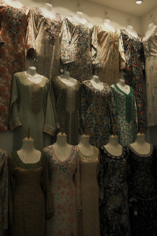 A room filled with lots of mannequins and dresses