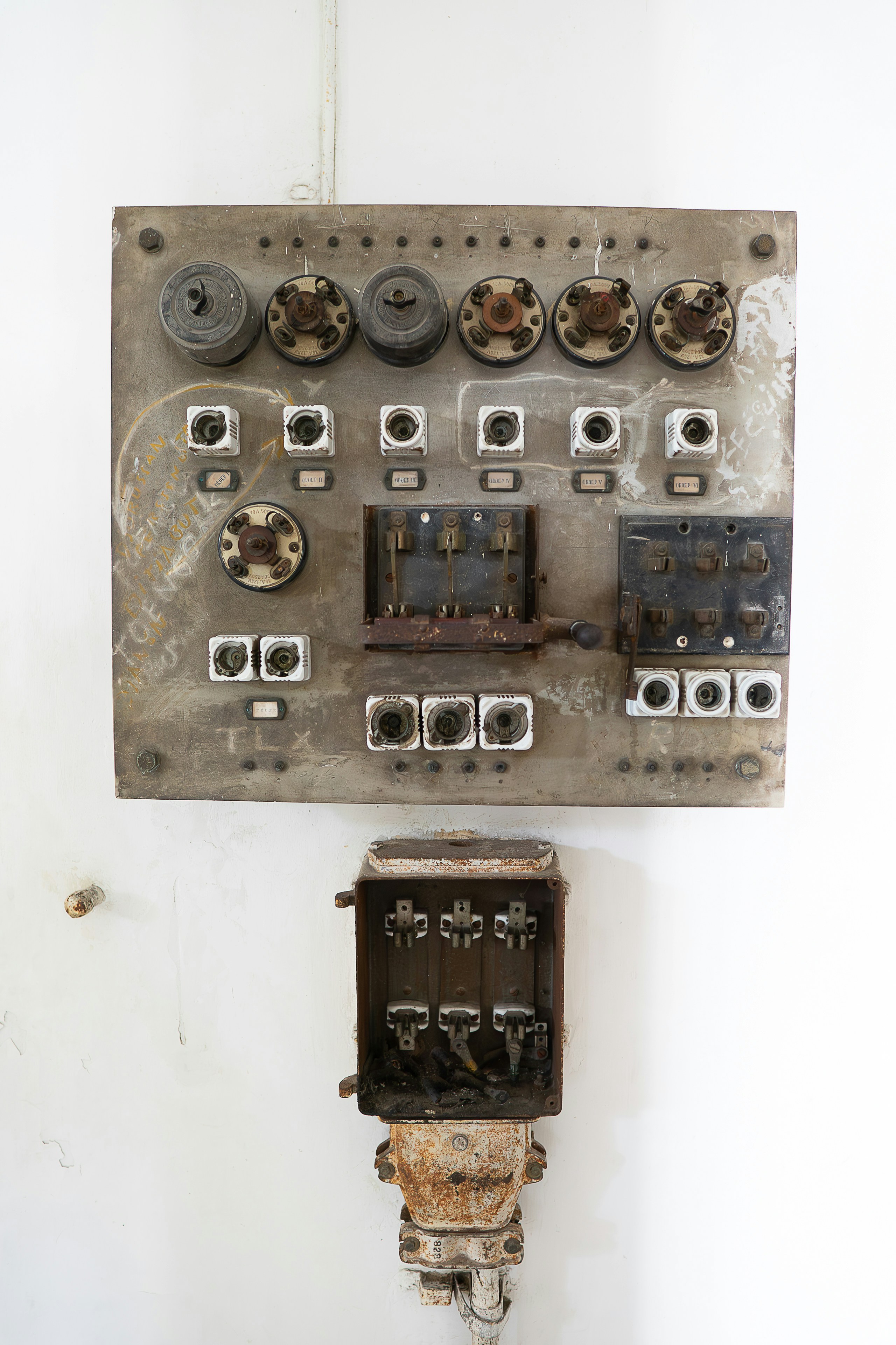 An old electrical panel mounted to a wall