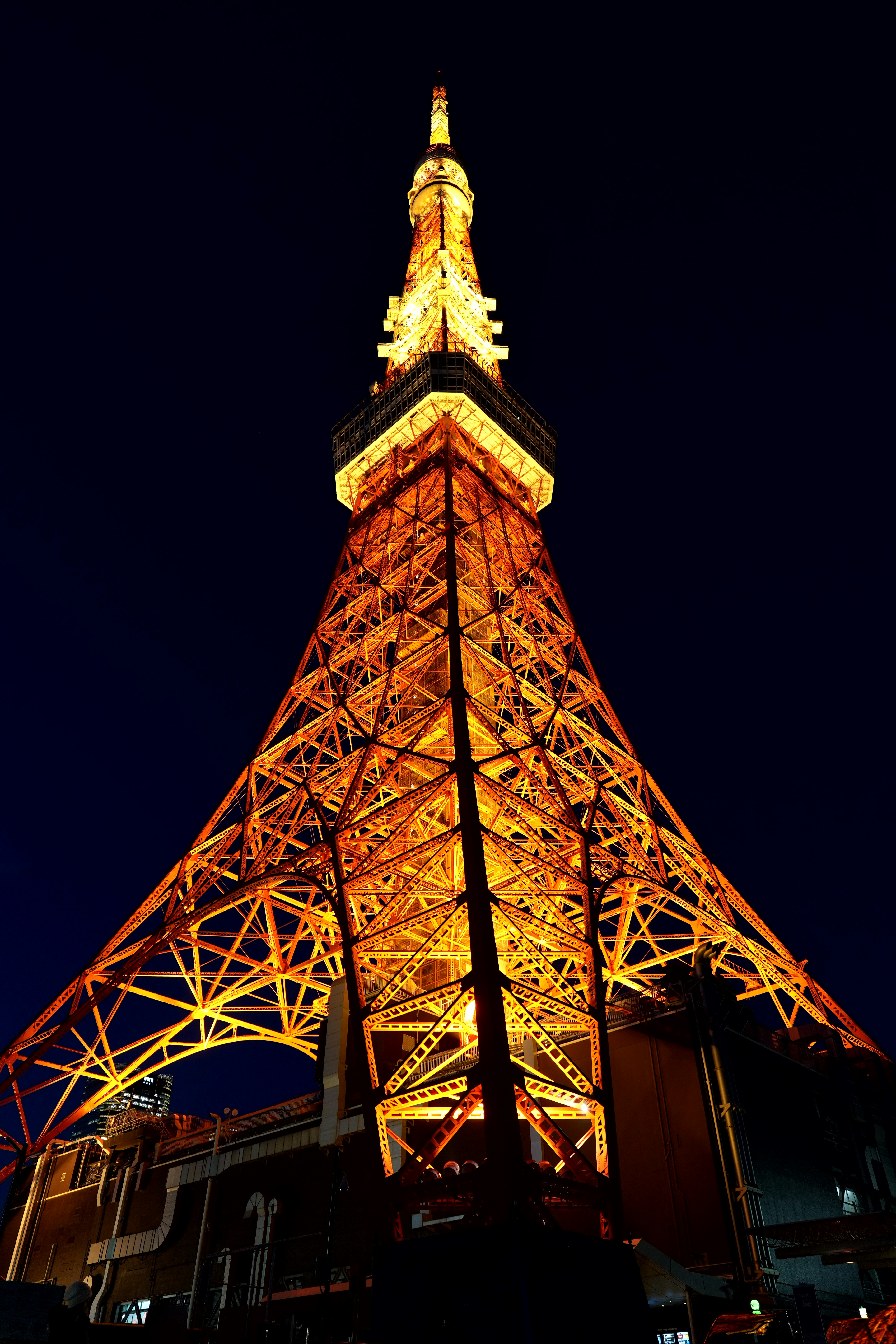 The eiffel tower is lit up at night photo – Free Tower Image on Unsplash
