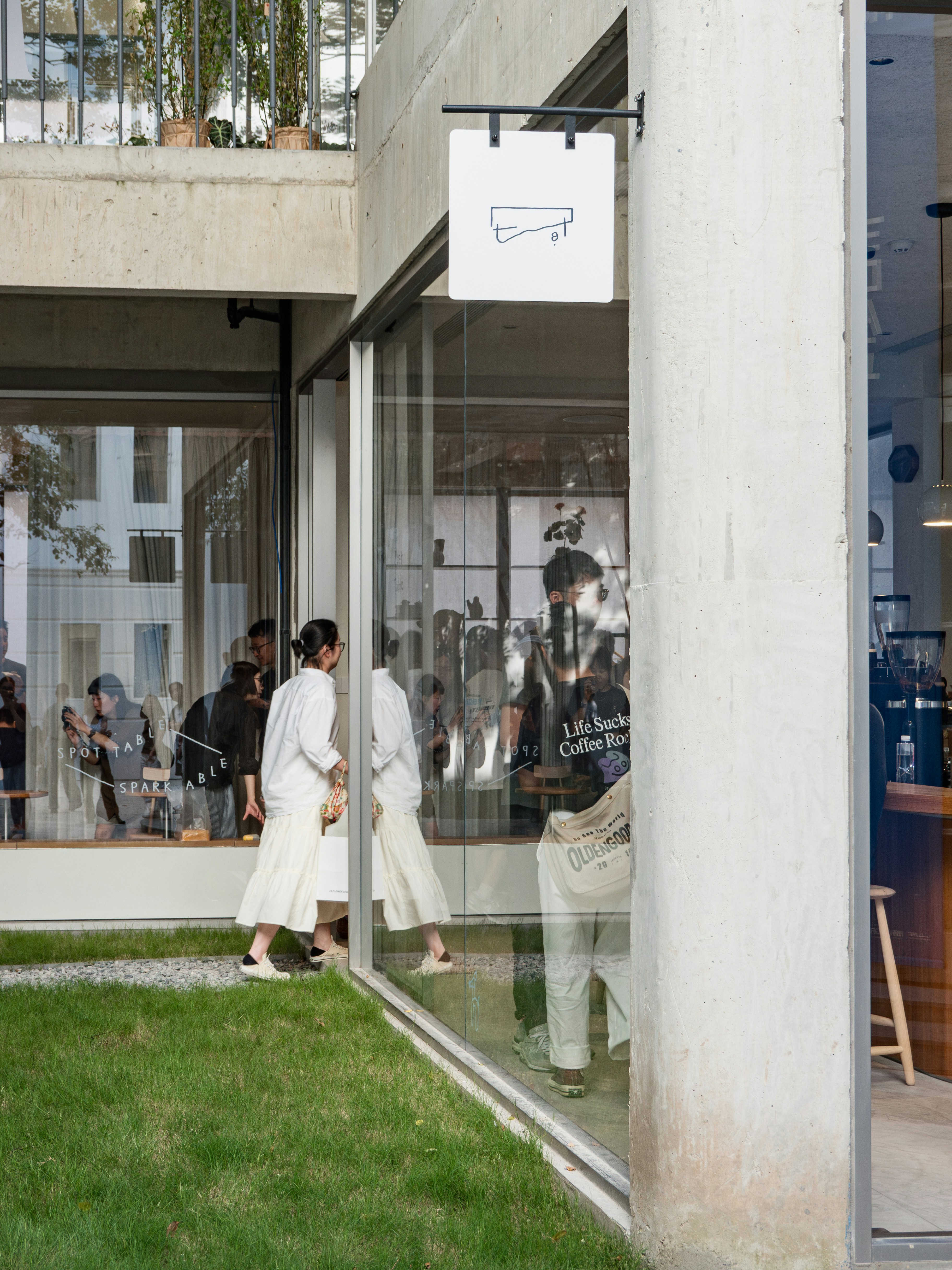 A group of people standing outside of a building