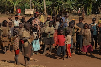 A group of people standing around each other
