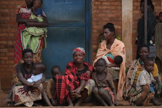 A group of people sitting next to each other