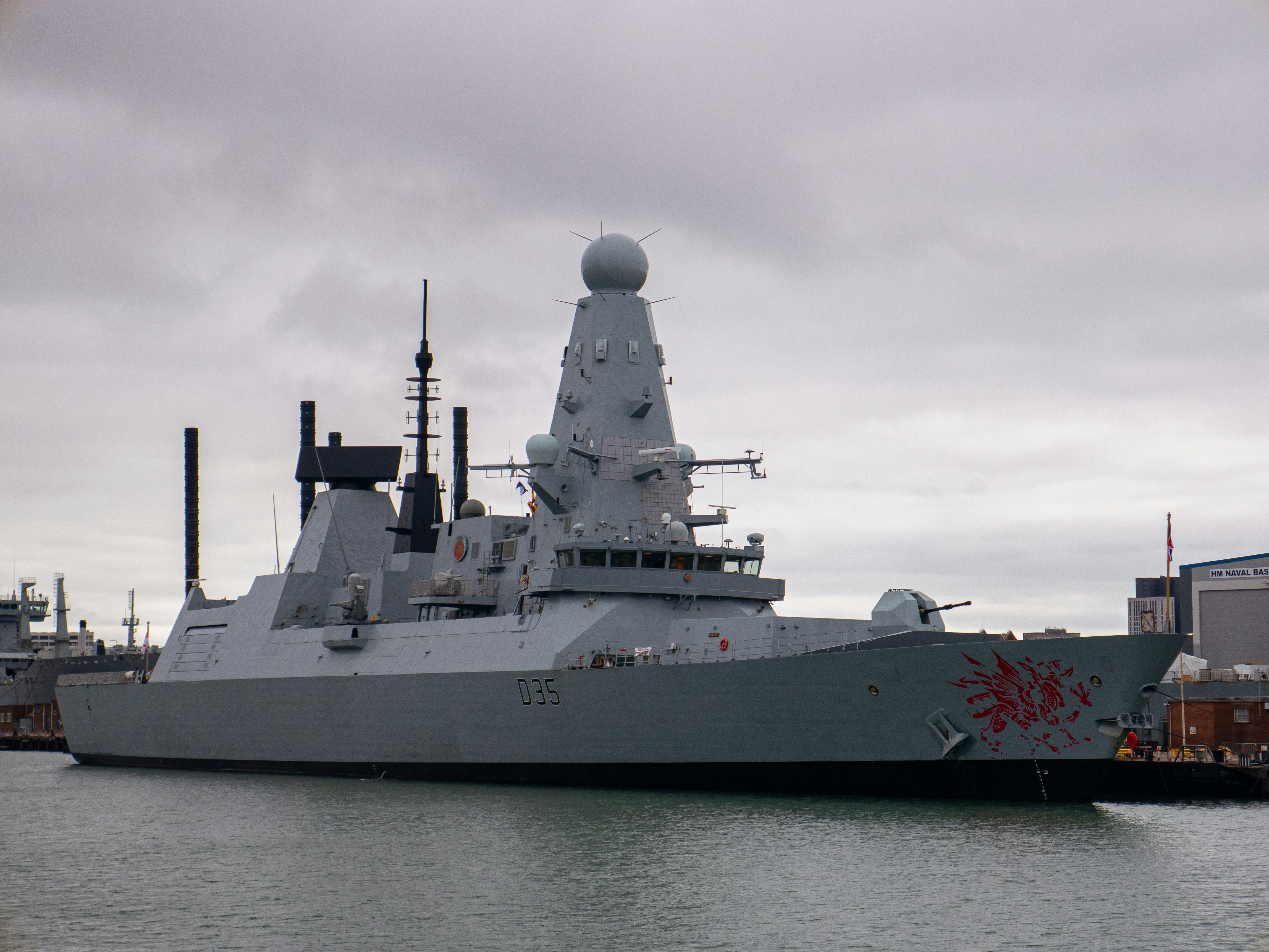 A large battleship sitting in the middle of a body of water