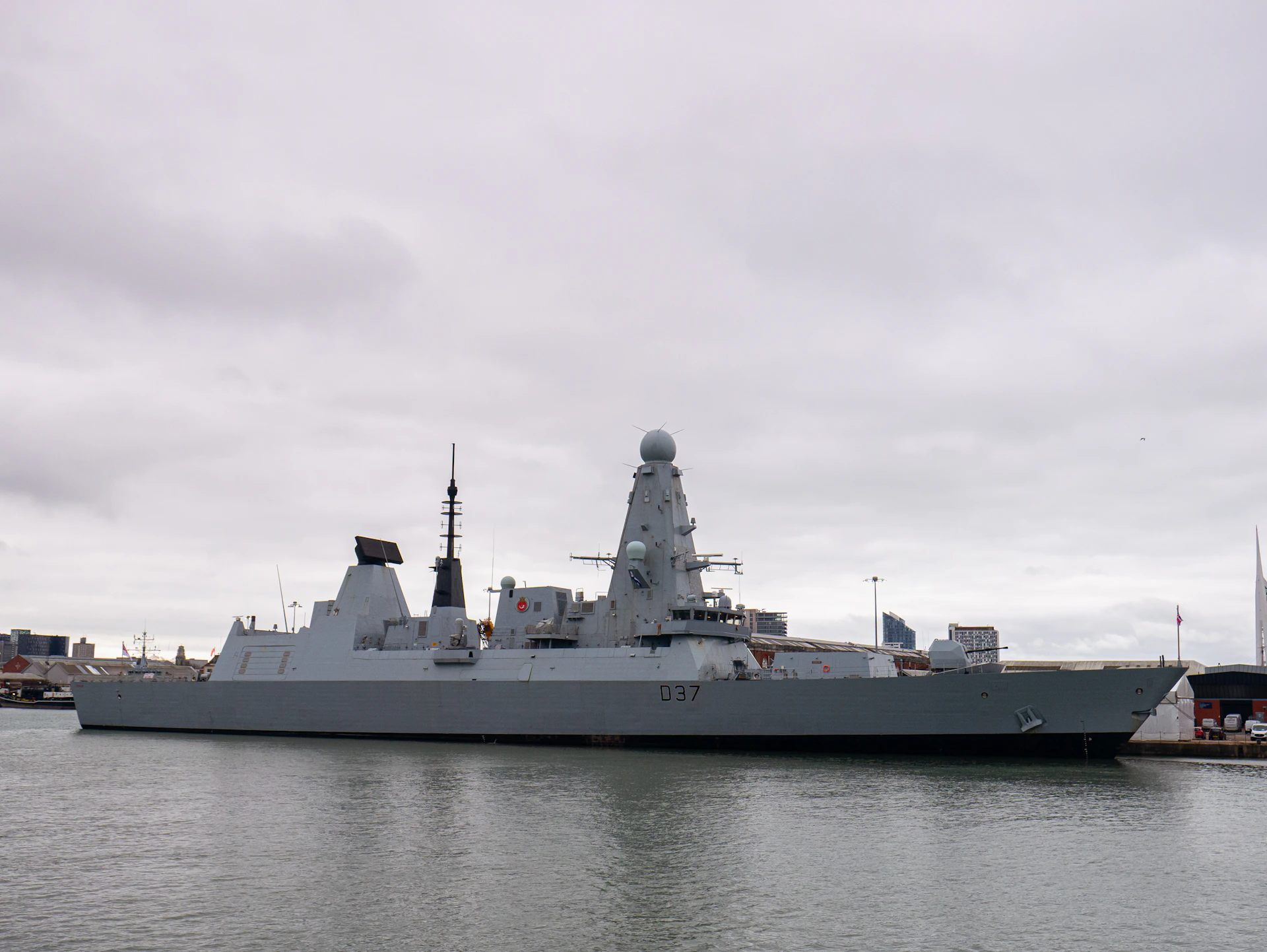 A large battleship sitting in the middle of a body of water