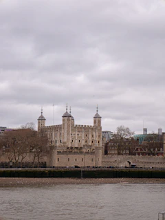 A large castle sitting next to a body of water