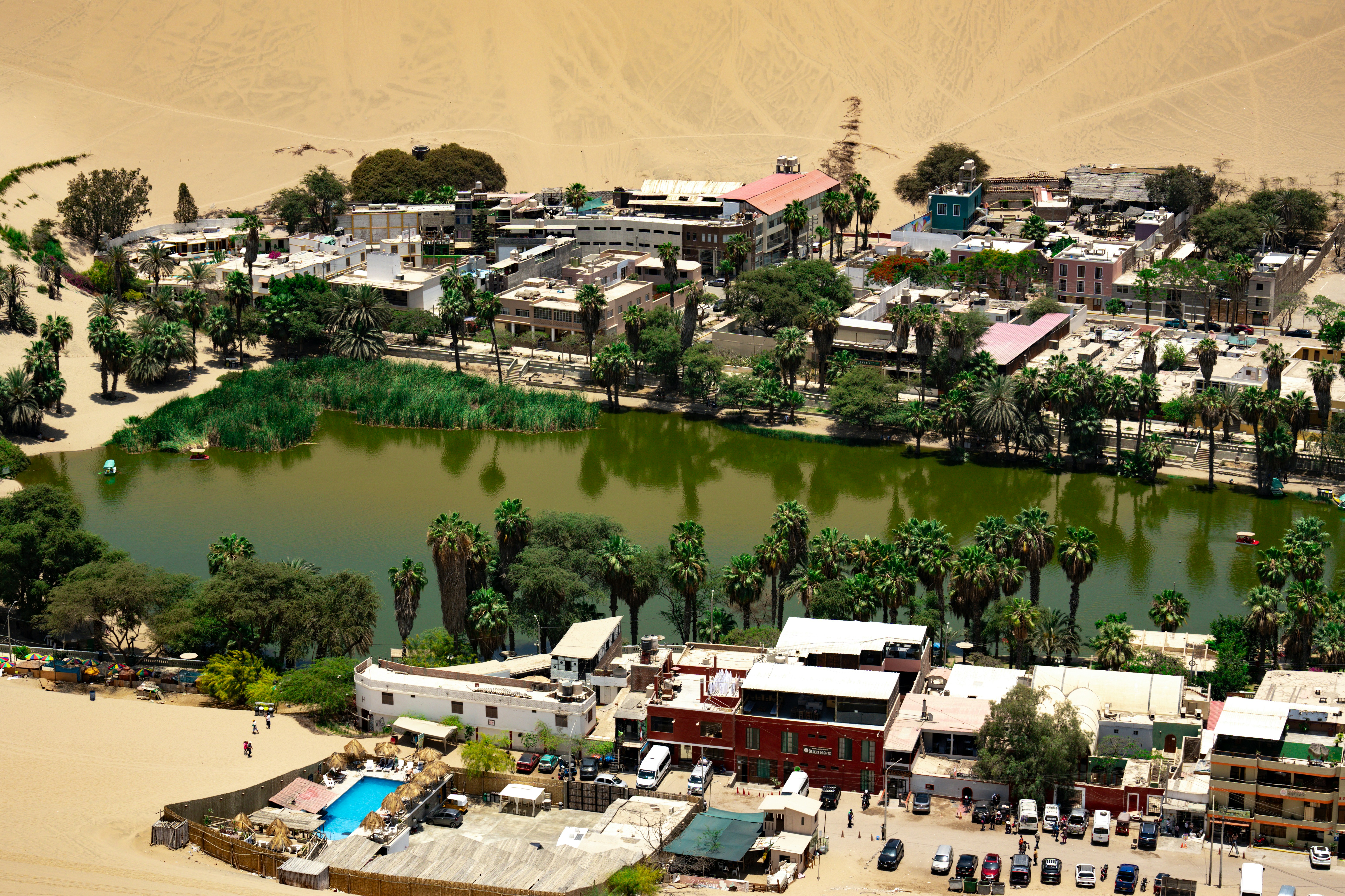 An aerial view of a small town and a lake