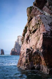 A large rock outcropping into the ocean
