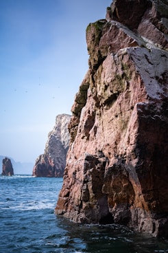 A large rock outcropping into the ocean