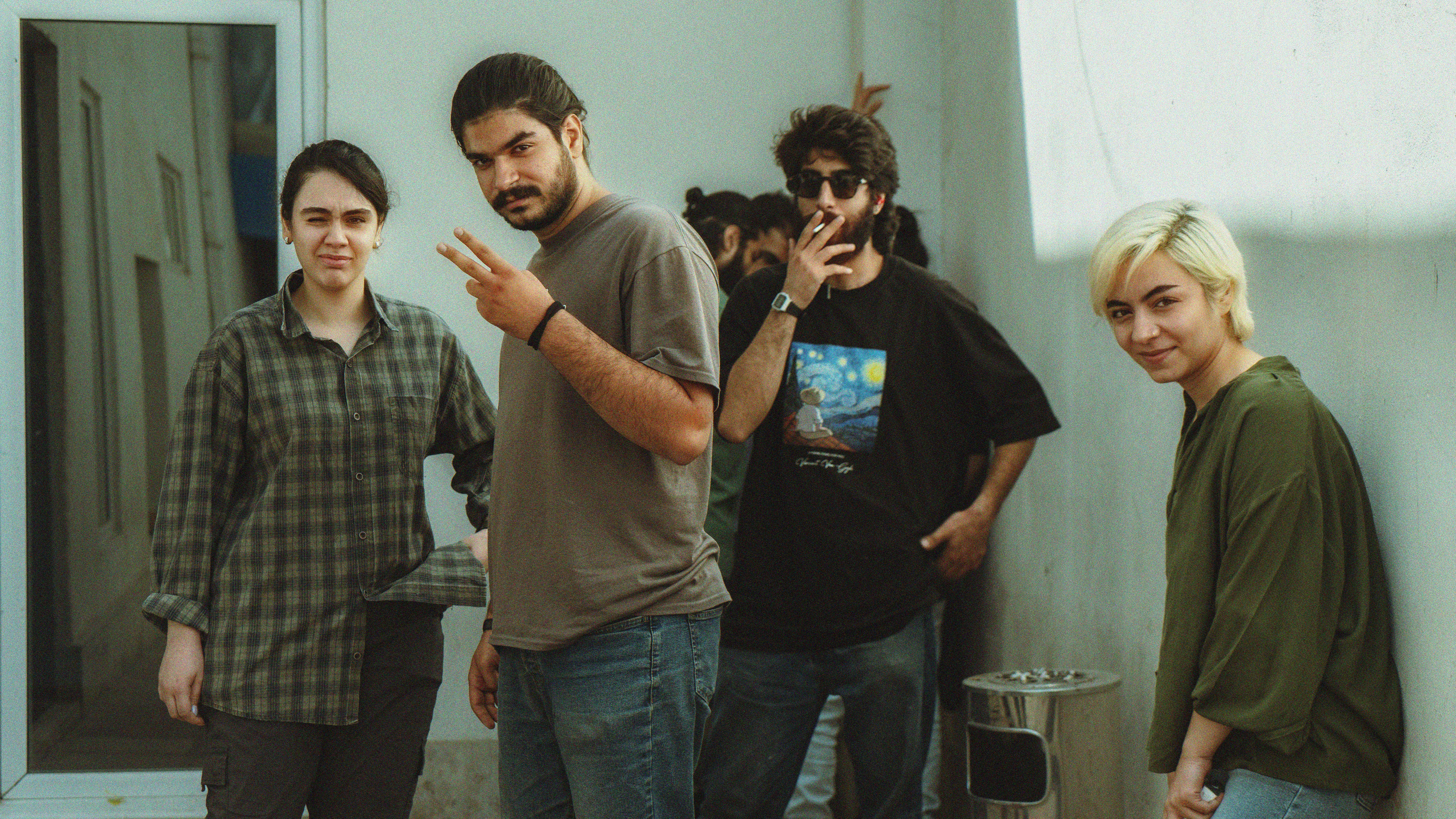 A group of young men standing next to each other