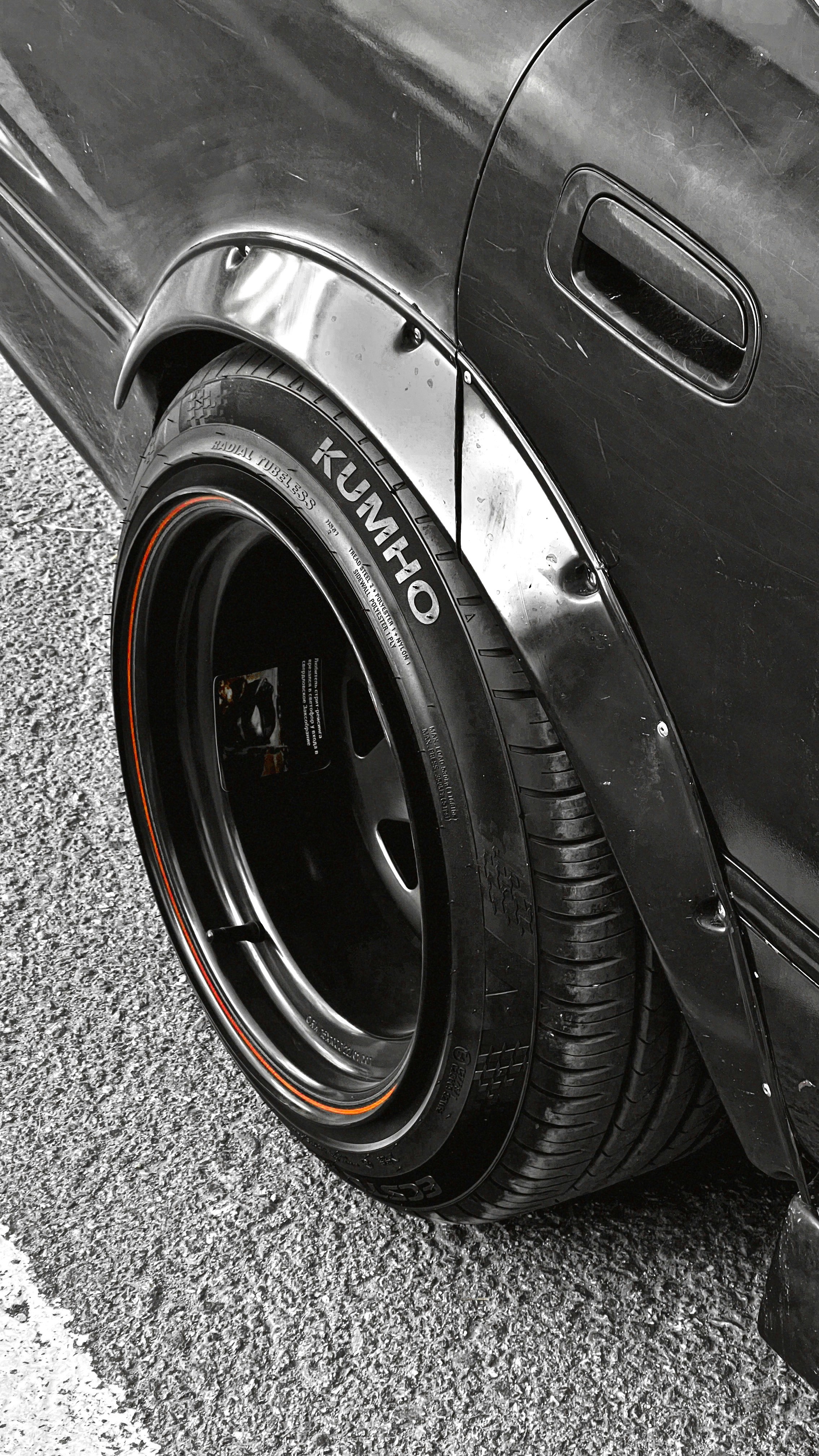 A close up of a tire on a car