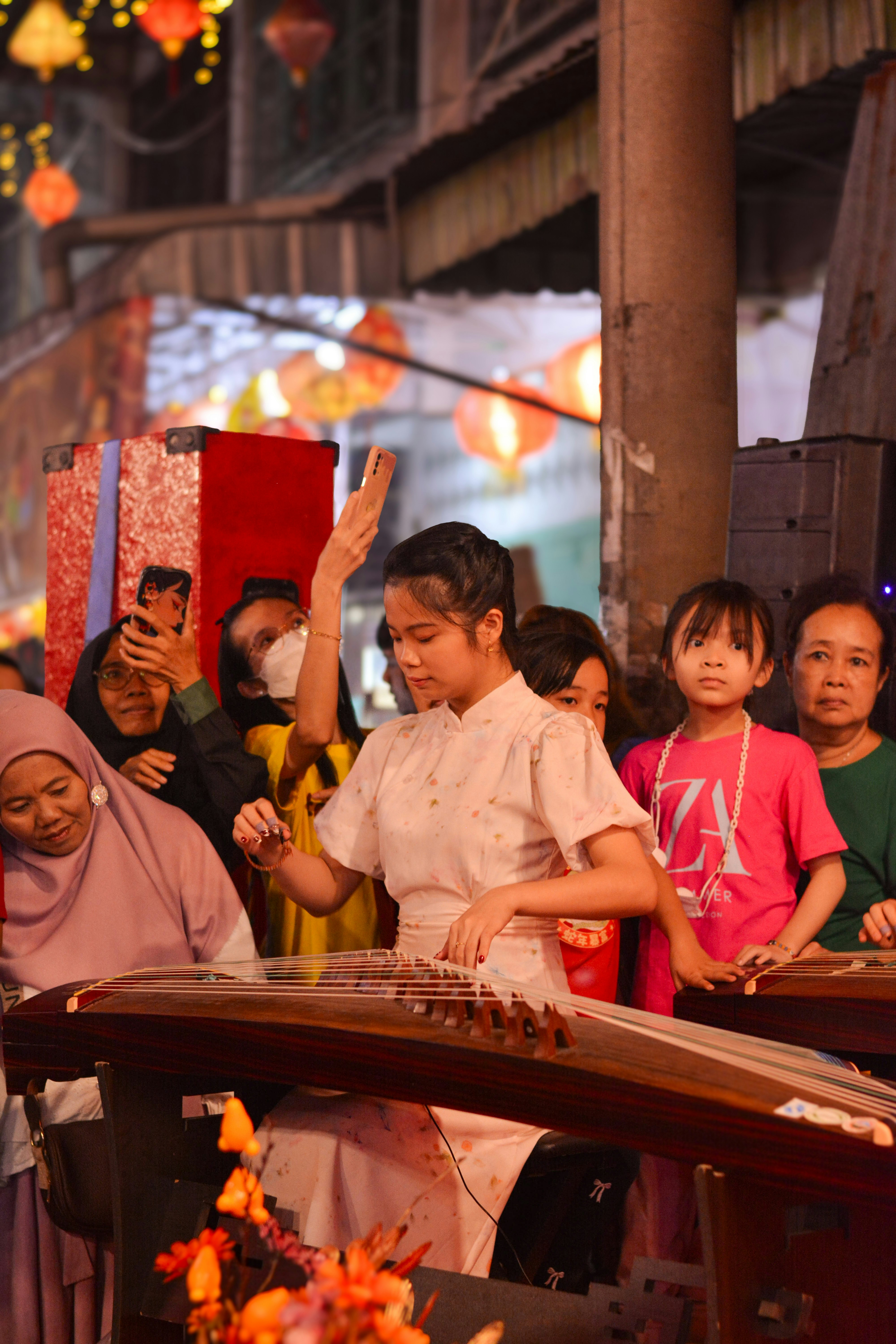 A group of people standing around each other