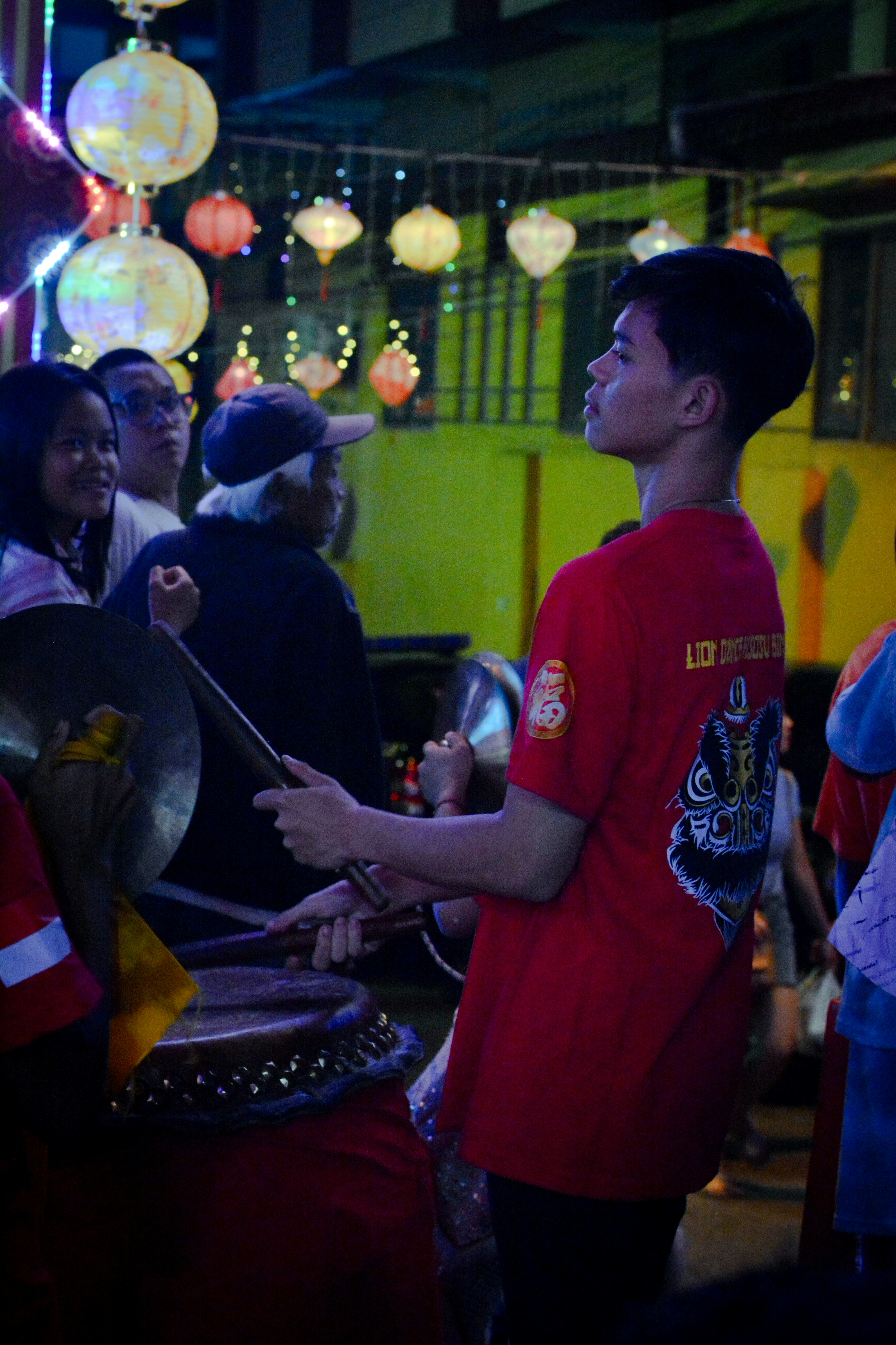 A group of people standing around each other