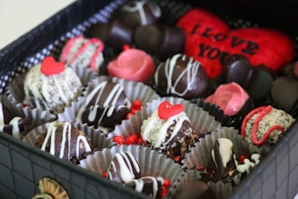 A box filled with lots of different types of chocolates