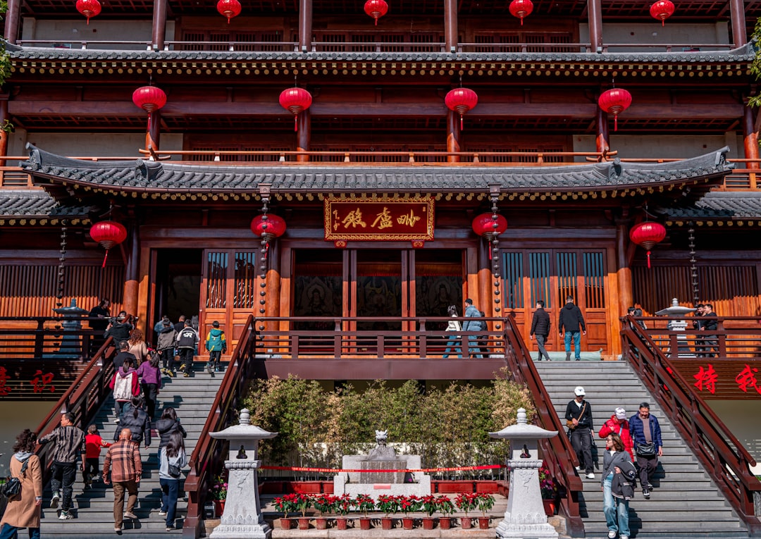 Traditional Chinese temple with tourists exploring the architecture