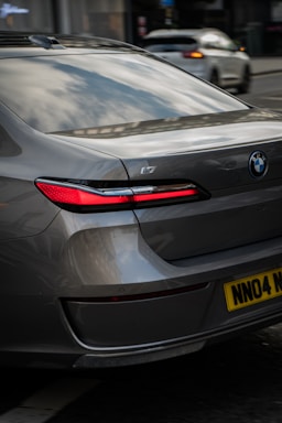 A silver car parked on the side of the road