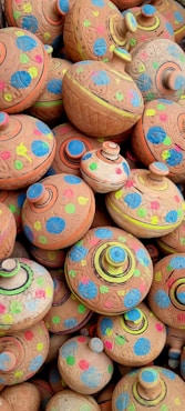 A pile of clay pots sitting on top of each other