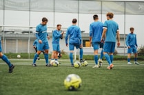 A group of young men playing a game of soccer