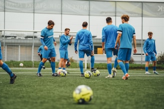 A group of young men playing a game of soccer