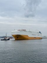 A large boat floating on top of a large body of water