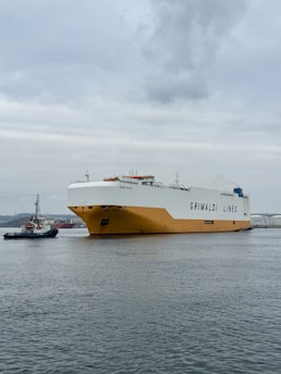 A large boat floating on top of a large body of water