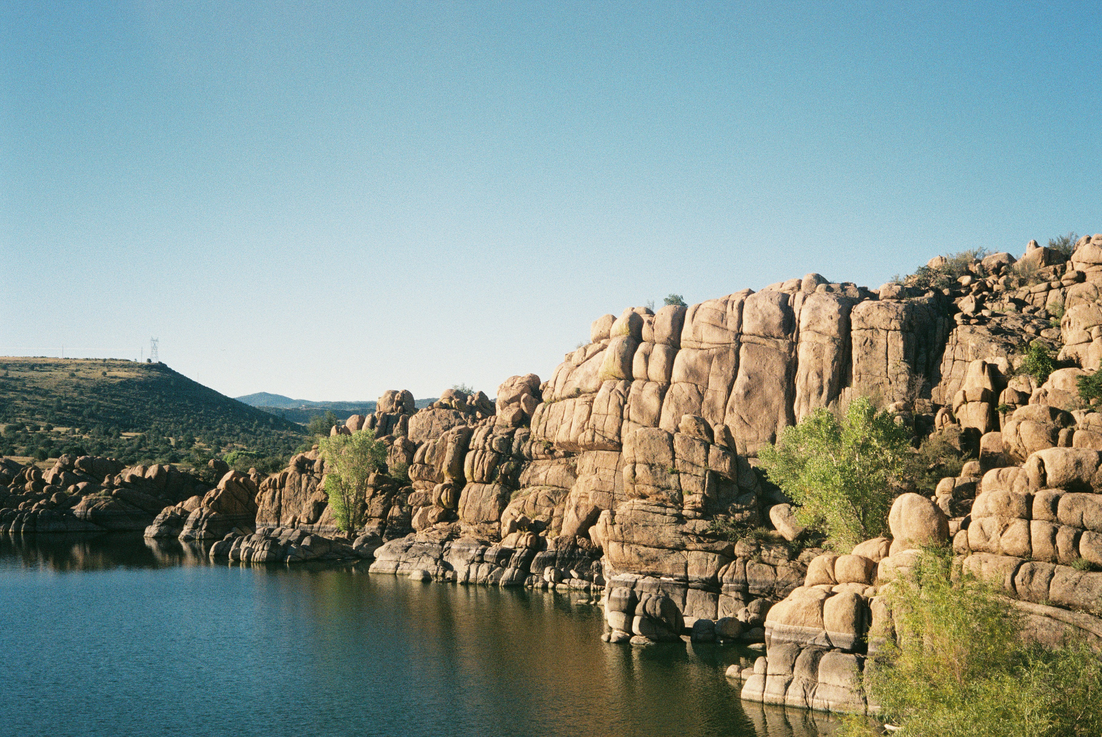 A large body of water surrounded by rocks