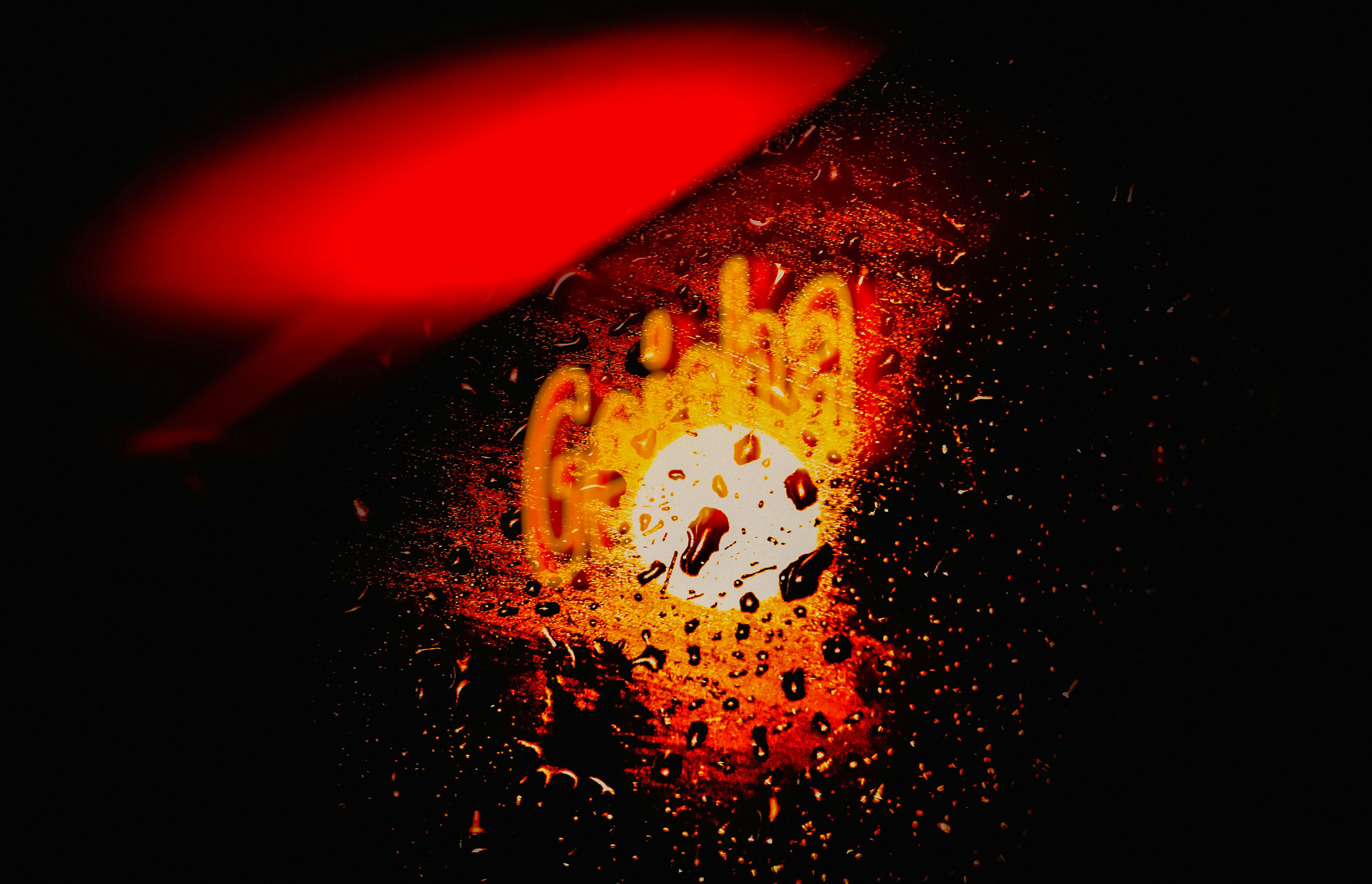 A close up of a red object in the dark photo – Free X Image on Unsplash