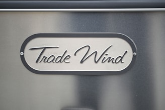 A close up of a metal sign on a wall