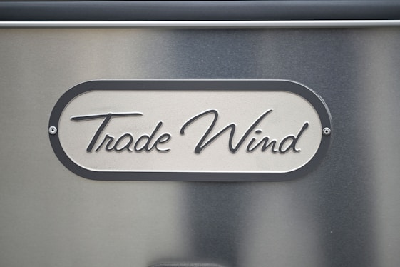 A close up of a metal sign on a wall