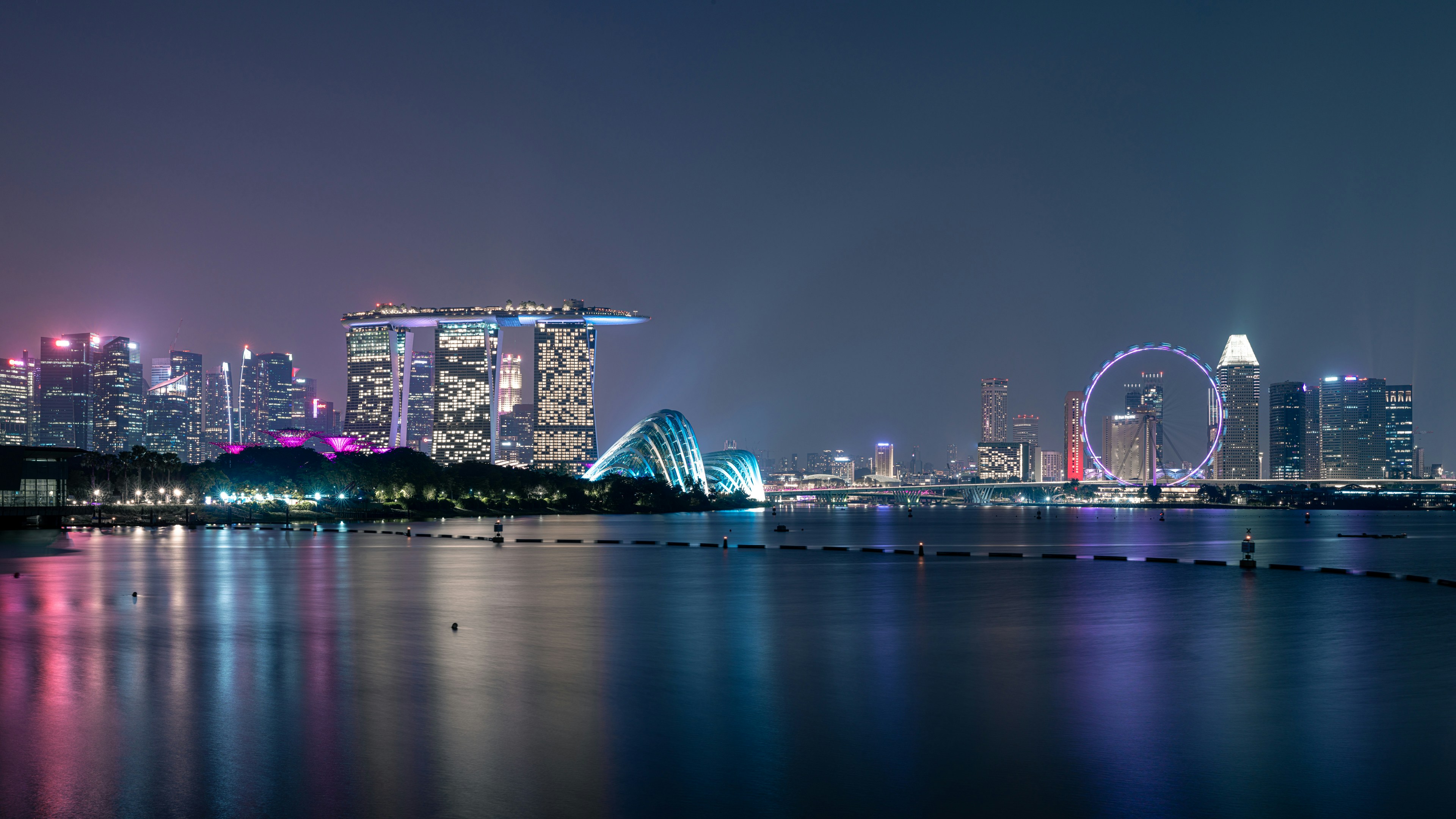 A view of a city at night from across the water