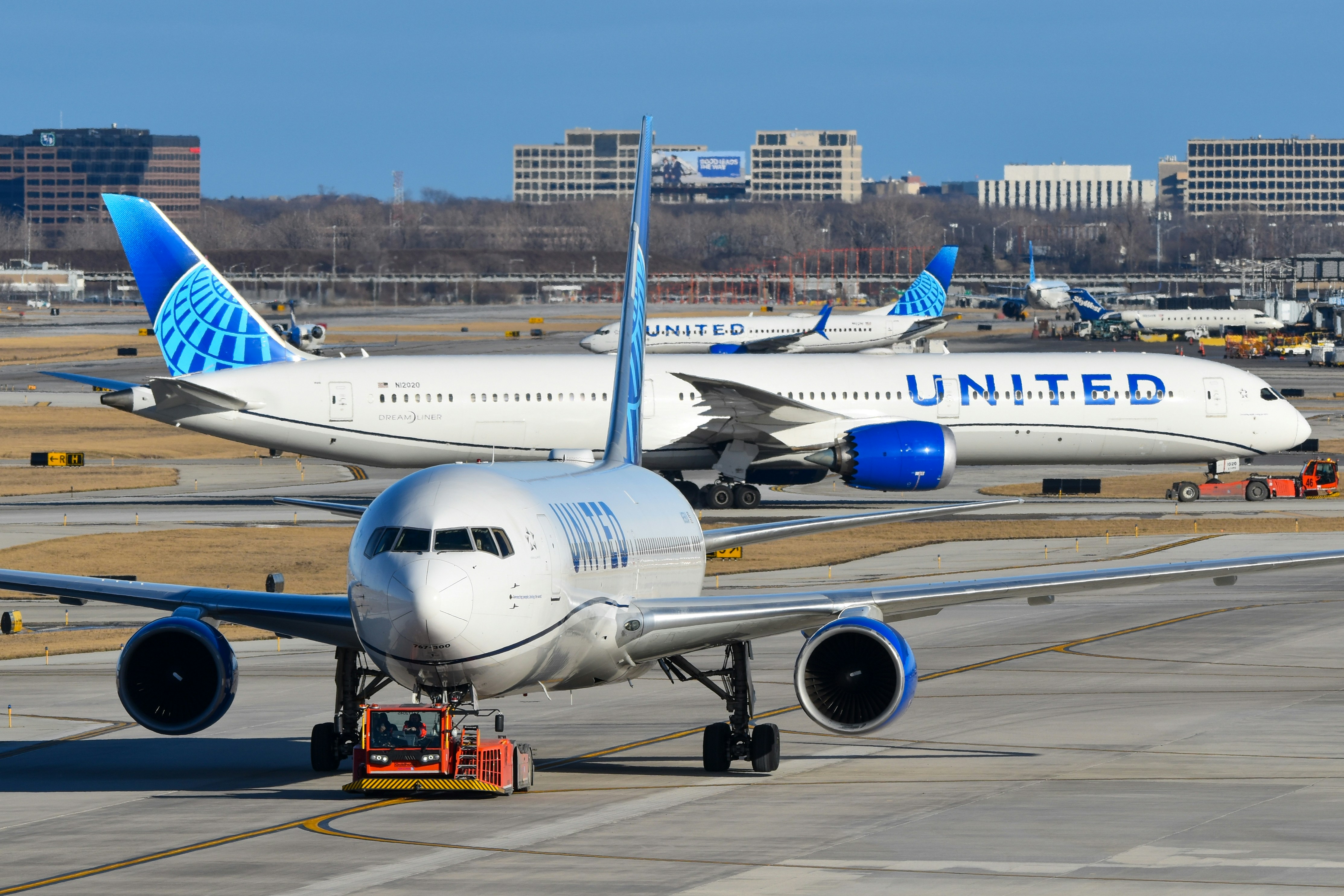 A large jetliner sitting on top of an airport tarmac