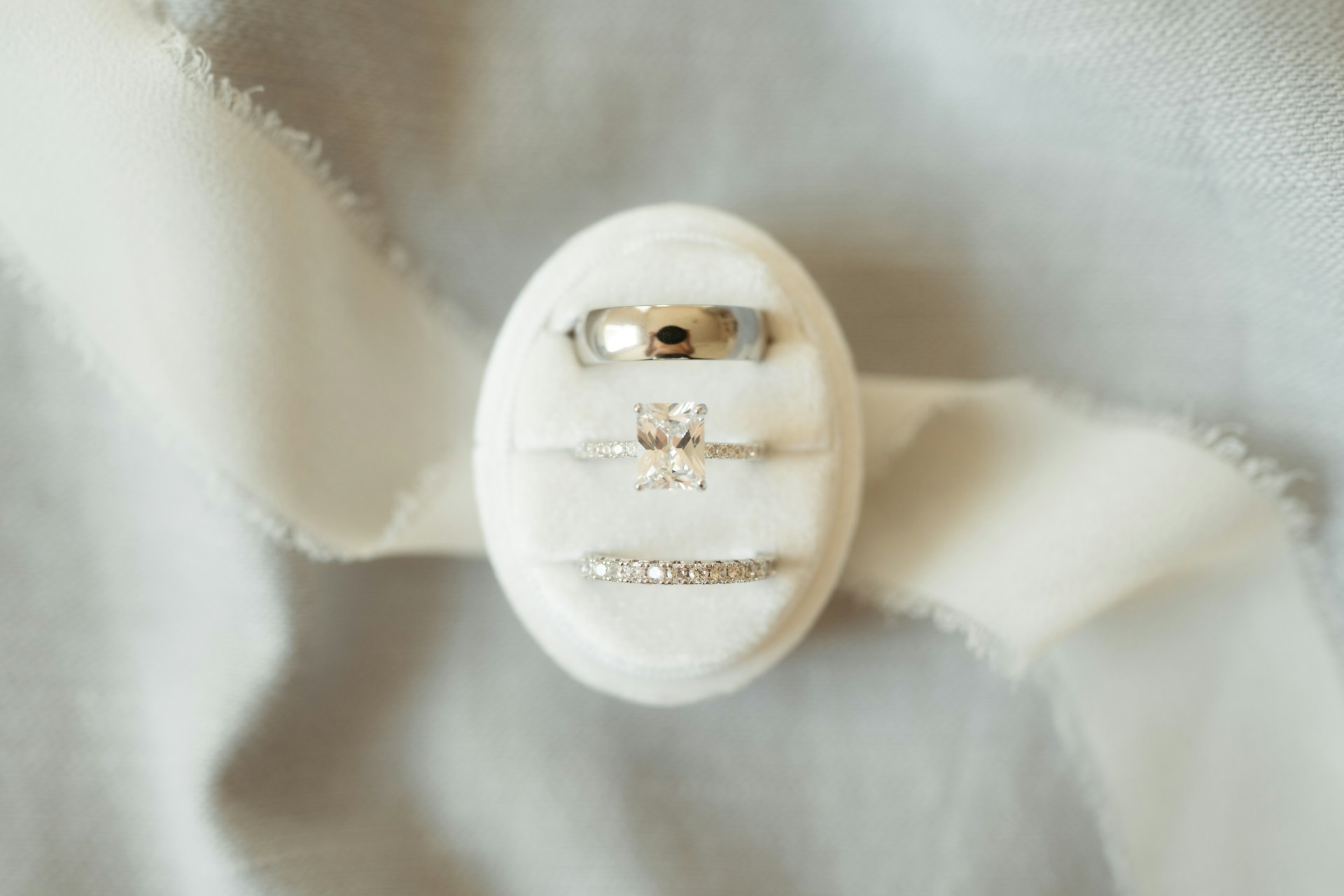 A close up of a button on a white cloth