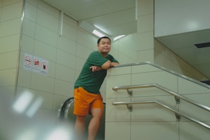 A man standing at the top of a stair case
