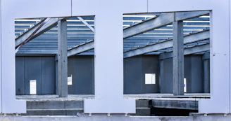 A large mirror reflecting a building's windows