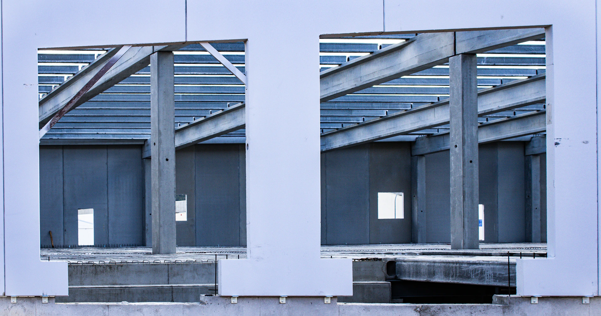 A large mirror reflecting a building's windows