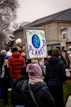 A group of people standing in front of a building