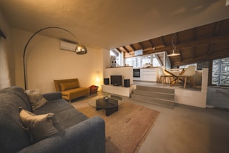 A living room filled with furniture and a fire place