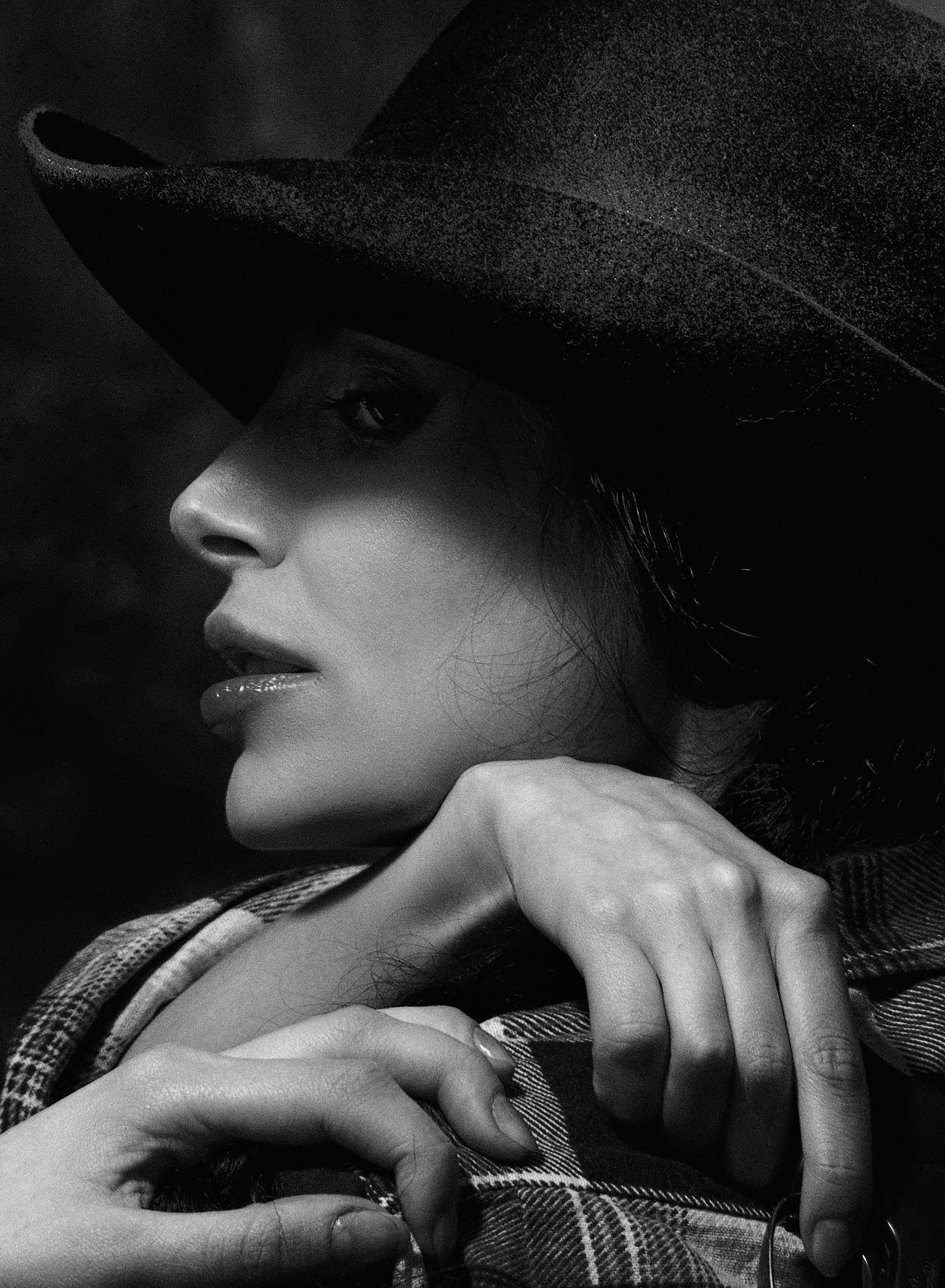 A woman wearing a hat and a coat